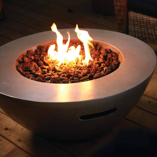 Fire pit with flames on a wooden deck